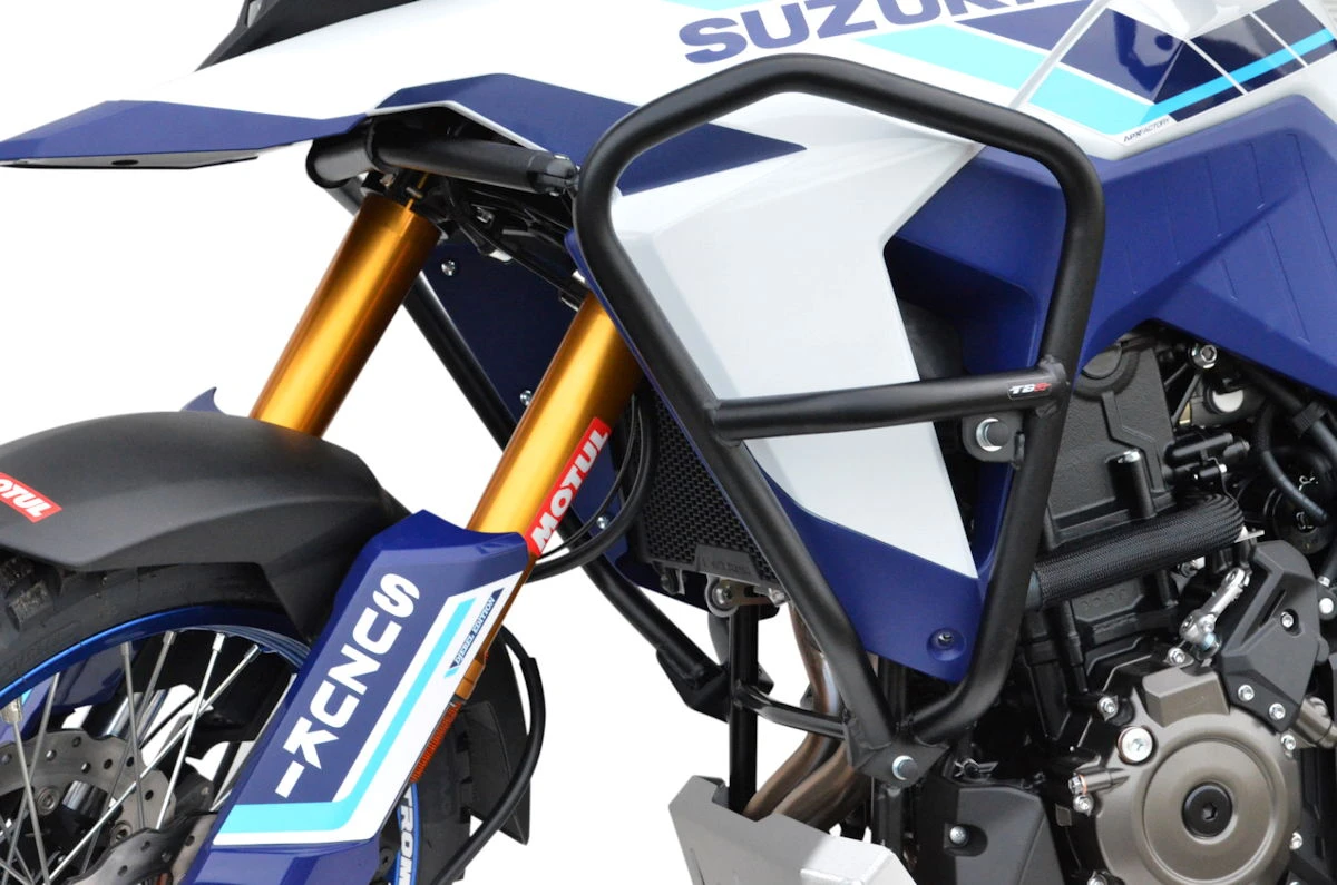 Des barres de protection noires sur l'avant d'une moto Suzuki V-Strom 800DE